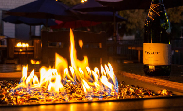Firepit with bottle of wine